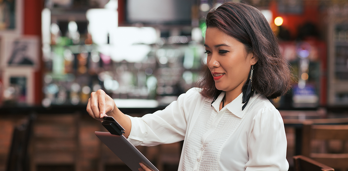 Bar-owner-swiping-credit-card-hero